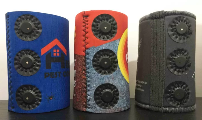 Magnetic stubby holders in Australia next to a white wall